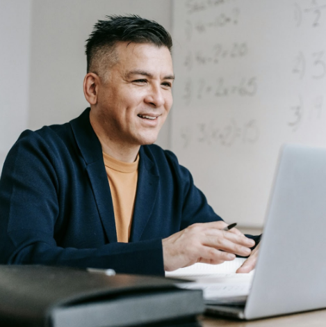 Man working at a computer.